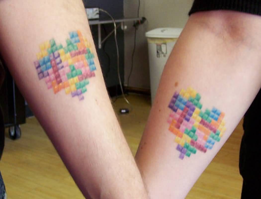 Colorful Heart Matching Couple Tattoos On Forearms