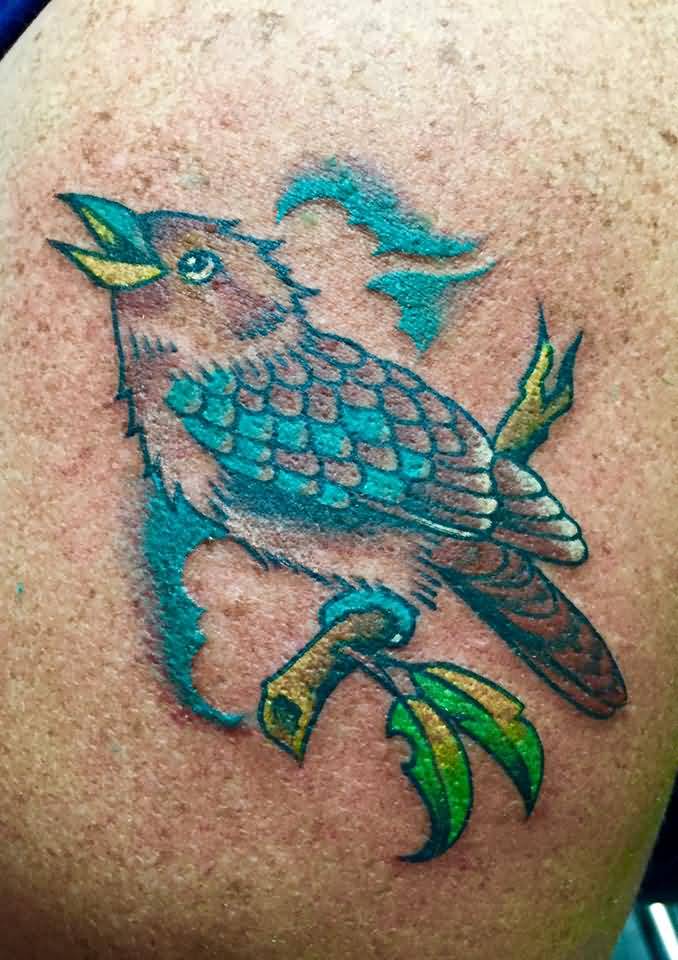 Colorful Kookaburra Looking Up With Tree Branch Tattoo