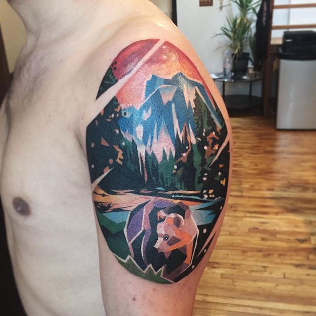 Colorful Mountains With Bear And Trees In Circle Tattoo On Left Shoulder