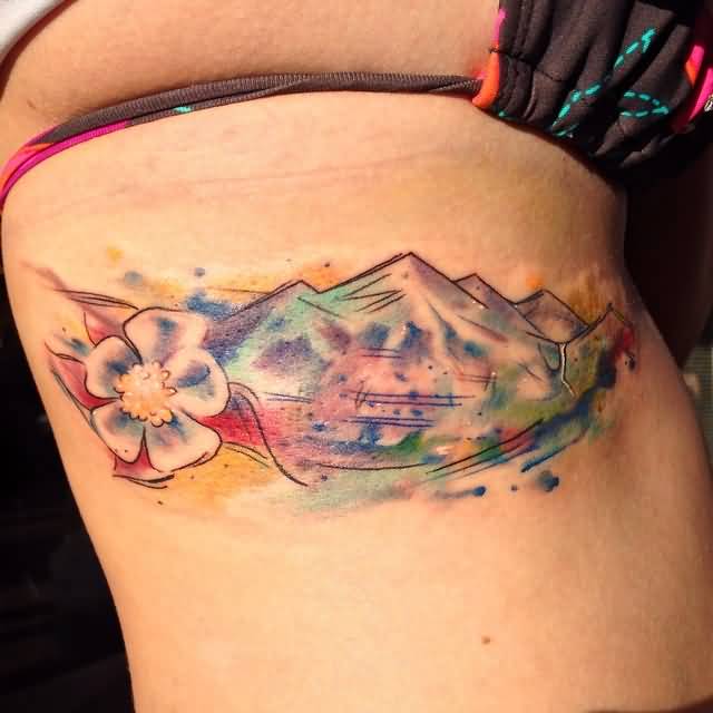Colorful Mountains With Flower Tattoo On Side Rib