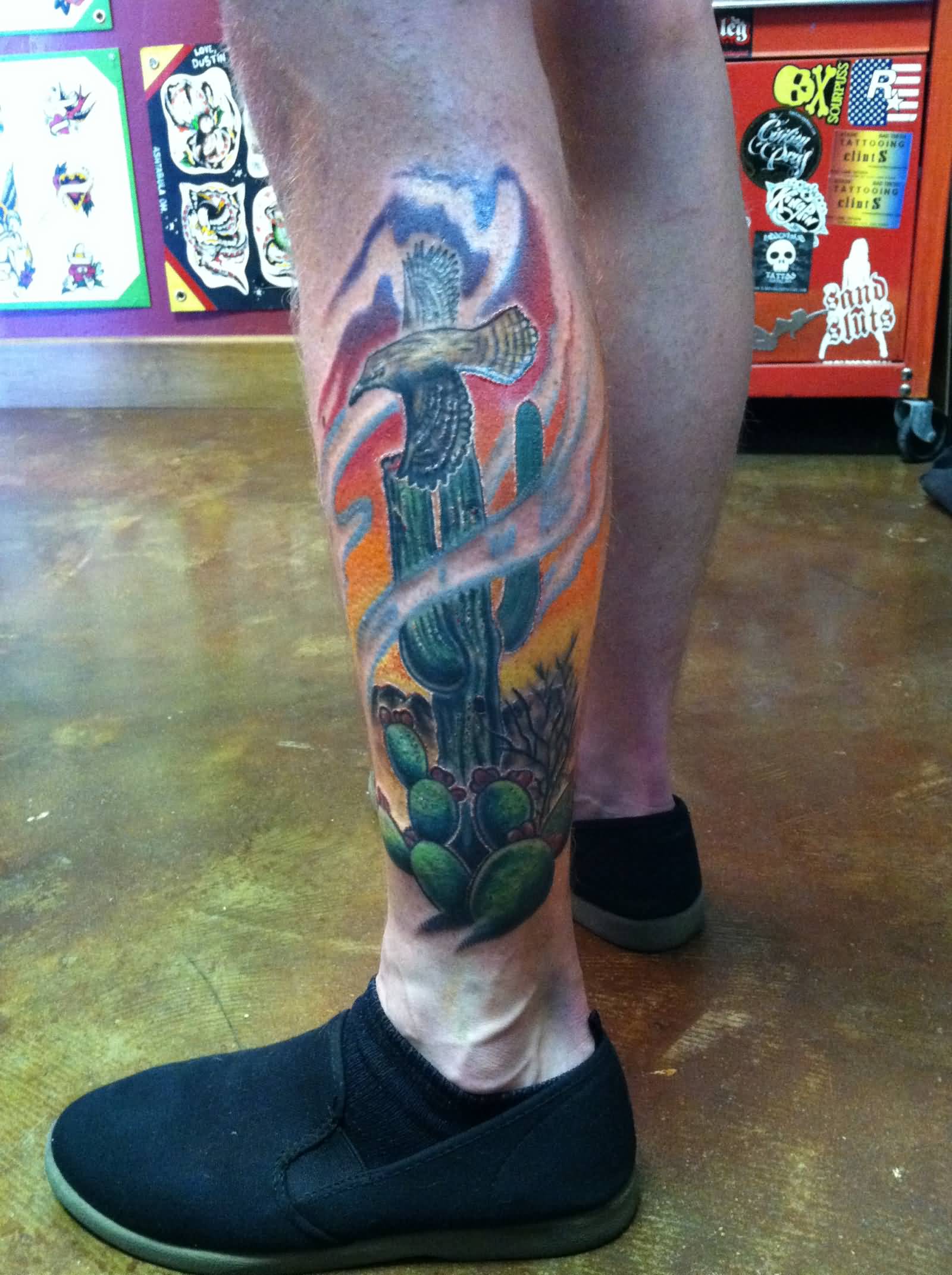 Colorful Saguaro Cactus With Flying Bird Traditional Tattoo On Back Leg