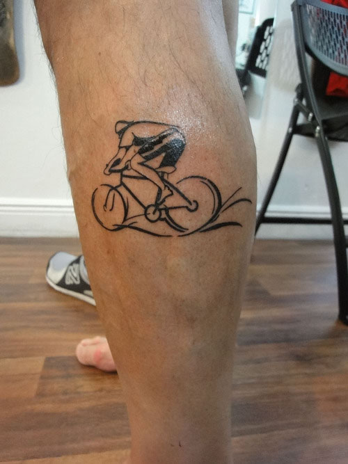 Cool Men Riding Cycle Tattoo On Leg