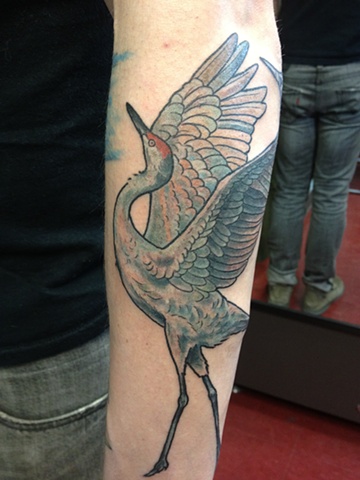 Crane Tattoo On Left Sleeve