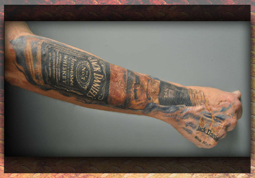 Creative Jack Daniel Bottle With Glass Tattoo On Arm Sleeve And Hand