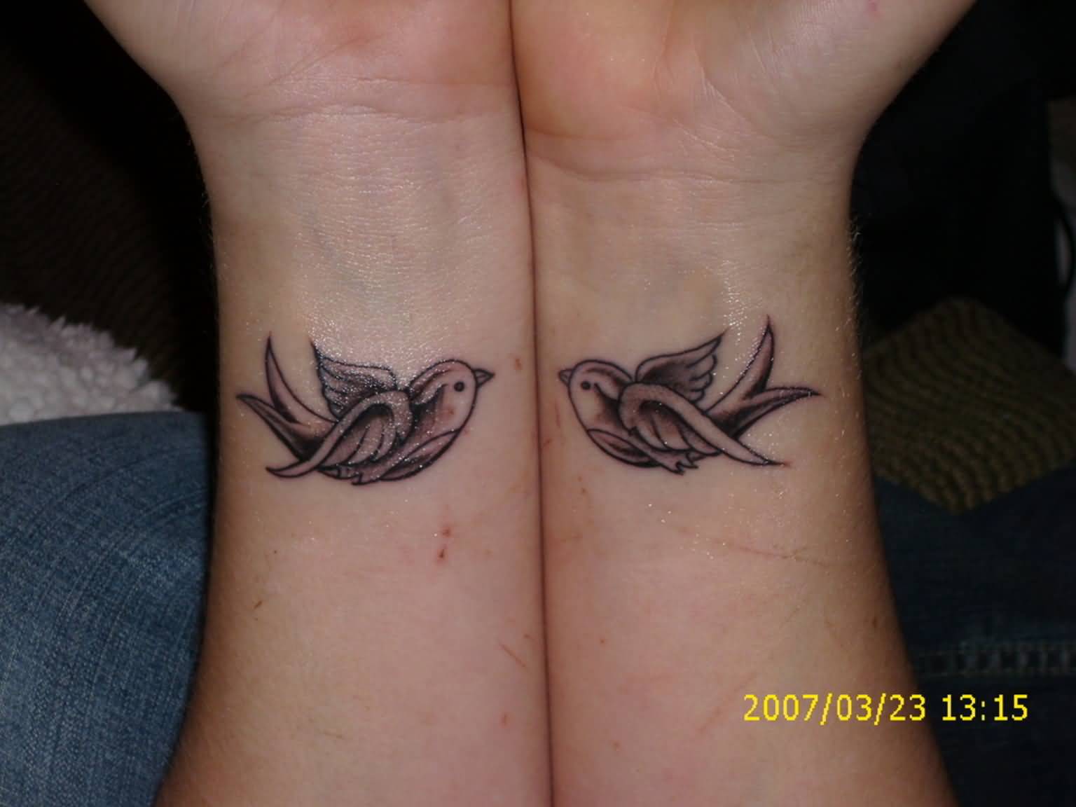 Cute Flying Birds Matching Tattoos On Both Wrists