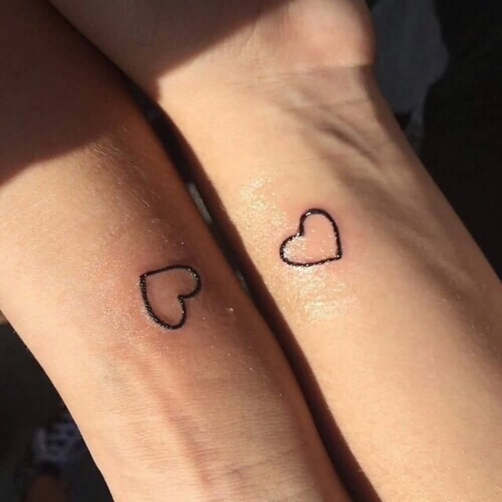 Cute Tiny Heart Outline Matching Tattoos On Wrists