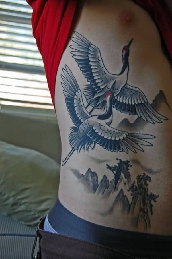 Flying Crane Tattoos On Side Rib For Men