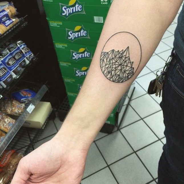 Geometric Mountains In Circle Tattoo On Forearm