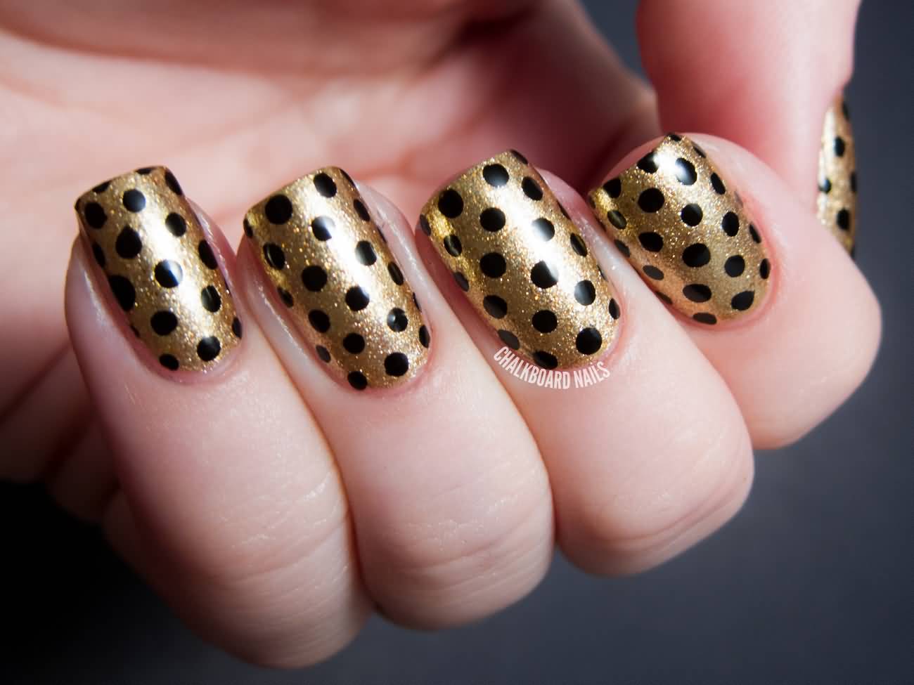 Gold Base Nails With Black Polka Dots Nail Art