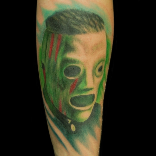 Green Color Slipknot Member Mask Tattoo On Forearm