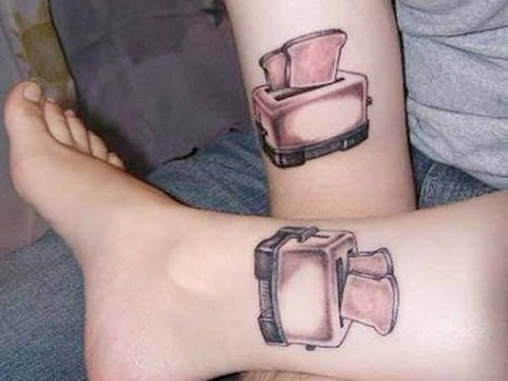 Grey Color Breads In Toaster Matching Tattoos On Leg And Forearm