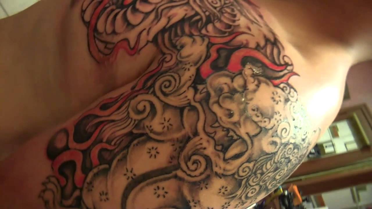 Grey Color Foo Dog With Flames Tattoo