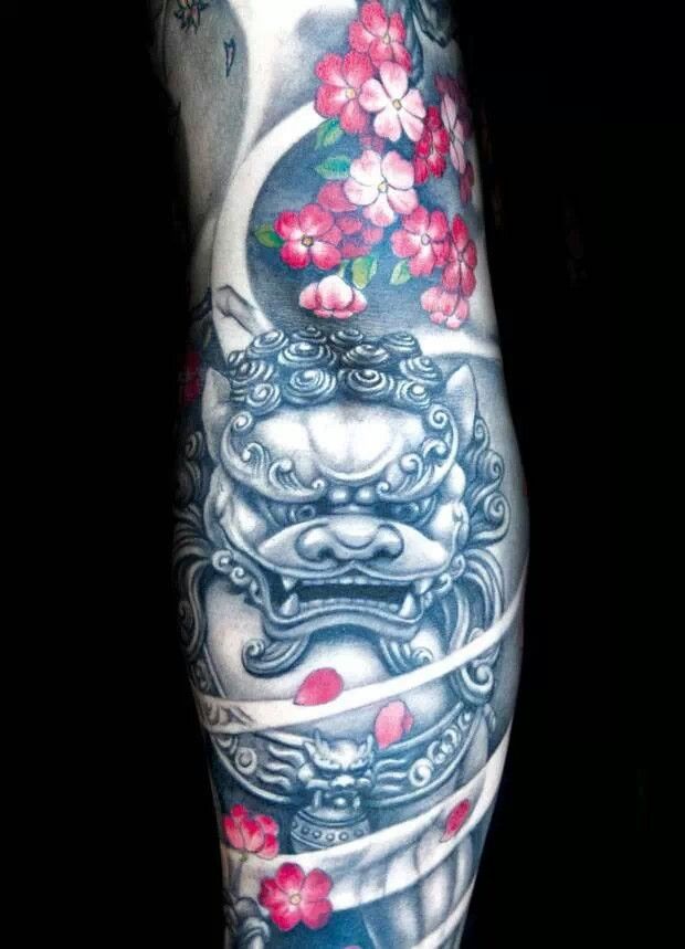 Grey Color Japanese Foo Dog With Red And Pink Flowers Tattoo