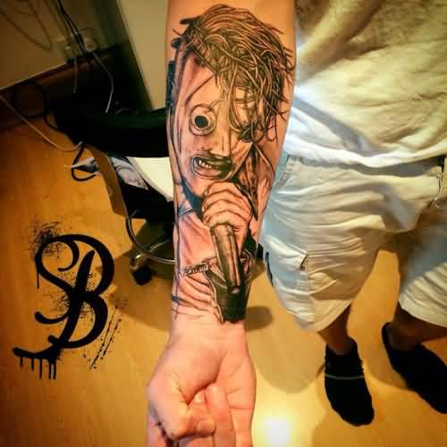 Grey Color Slipknot Member Tattoo On Forearm