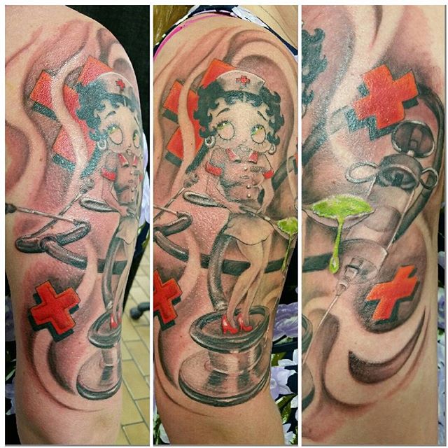 Grey Ink Betty Boop Nurse Tattoo On Half Sleeve