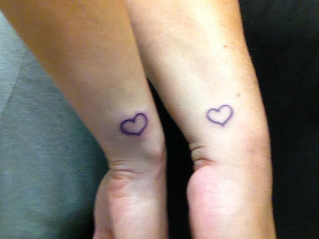 Heart Outline Matching Couple Tattoos On Wrists