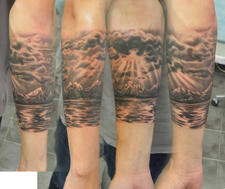 Incredible Mountains With Clouds And Water Tattoo On Arm Sleeve