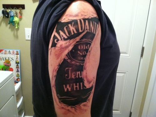 Jack Daniel Bottle Label In Seven Shape Tattoo On Right Shoulder