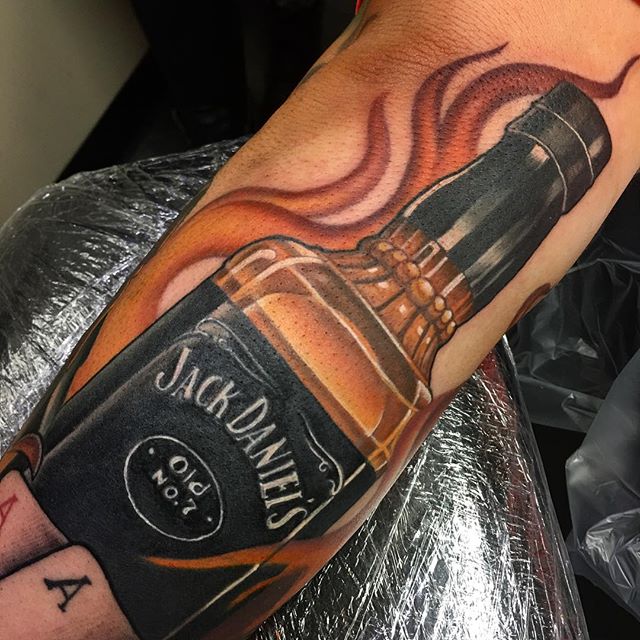 Jack Daniel With Flames Traditional Tattoo On Arm Sleeve