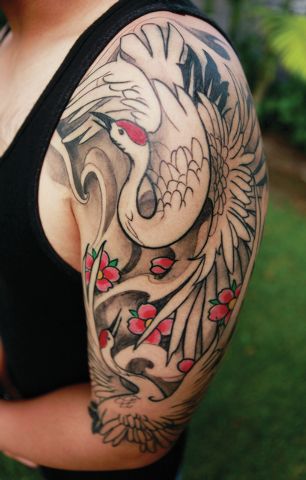 Japanese Crane Tattoo On Girl Left Half Sleeve