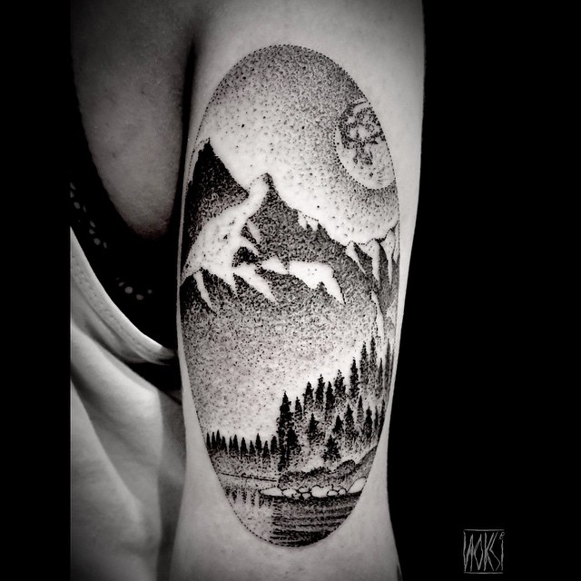 Landscape Mountains Lake In Circle Tattoo On Triceps