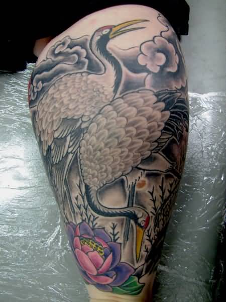 Lotus And Japanese Crane Tattoos On Leg