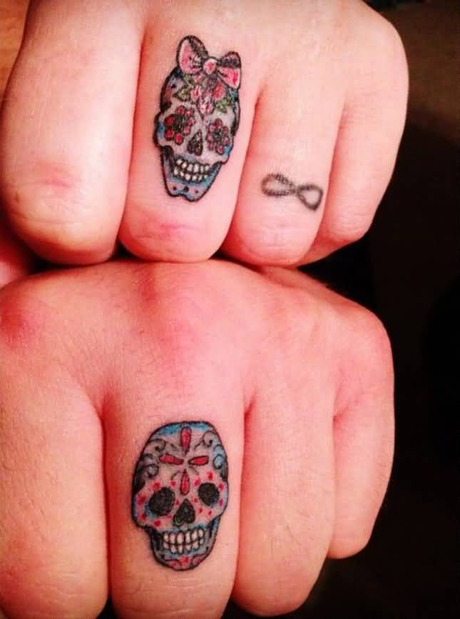 Male And Female Sugar Skulls Matching Couple Tattoos On Fingers