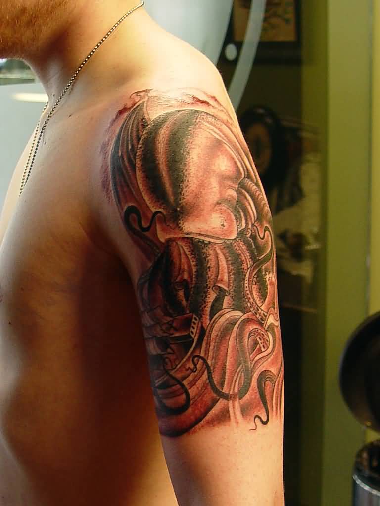 Man With Cthulhu Tattoo On Left Half Sleeve