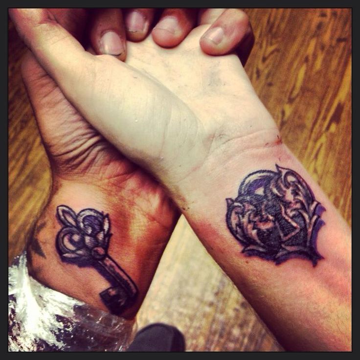 Matching Nicely Designed Key And Heart Lock Tattoos On Wrists