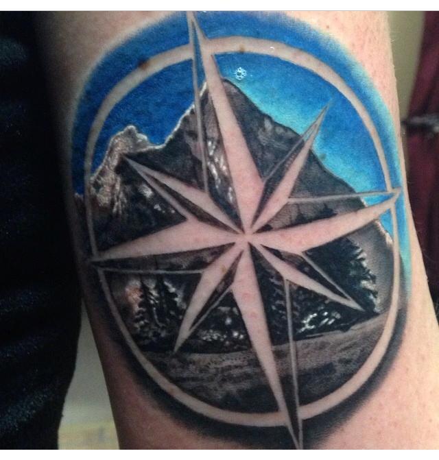 Mountain Scene In Negative Compass Tattoo