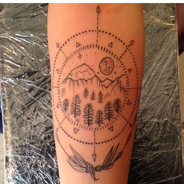 Mountains And Pine Trees In Compass Tattoo On Forearm