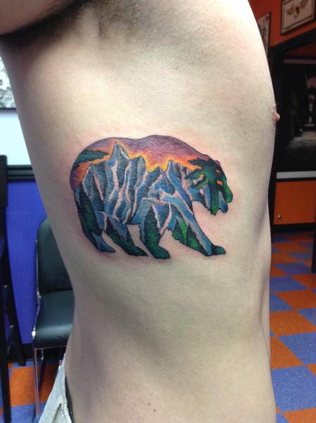 Mountains And Trees On Bear Traditional Tattoo On Side Rib