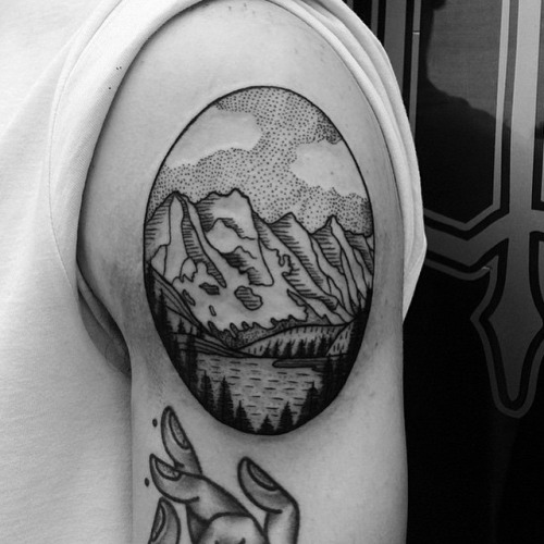 Mountains Scene In Circle Tattoo On Right Shoulder
