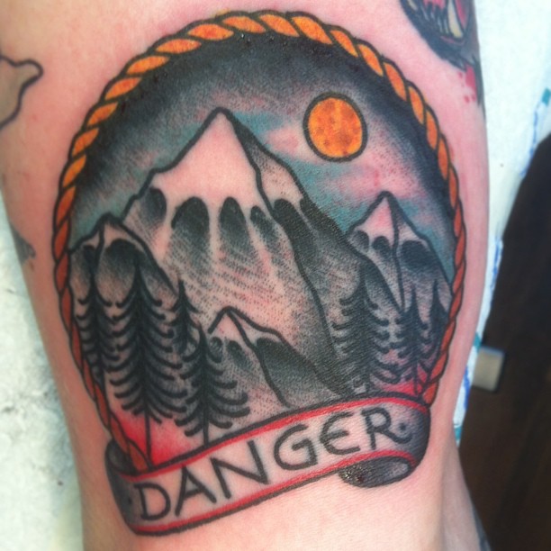Mountains With Trees And Sun In Circle And Banner Traditional Tattoo