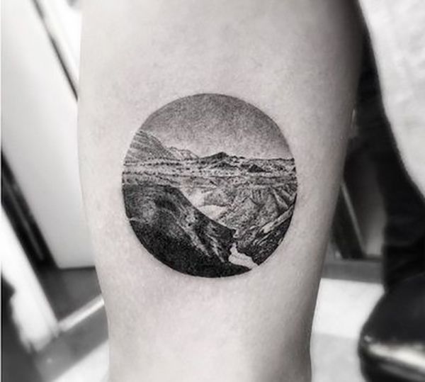 Nice Black And White Mountains In Circle Tattoo