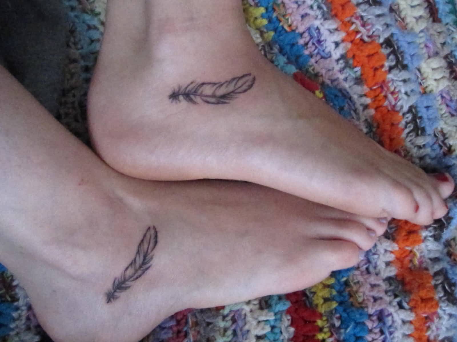 Nice Feather Matching Tattoos On Foots