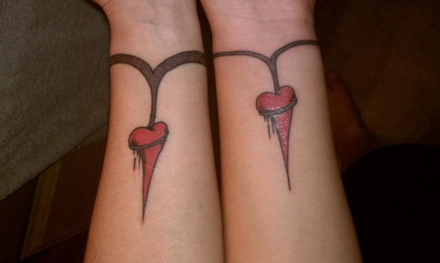 Nice Heart Committing Suicide Matching Tattoo On Wrists