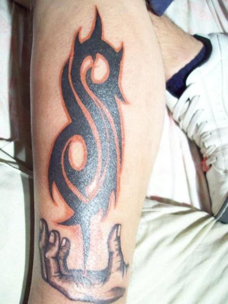 Nice Slipknot Tribal Logo With Hand Tattoo On Leg