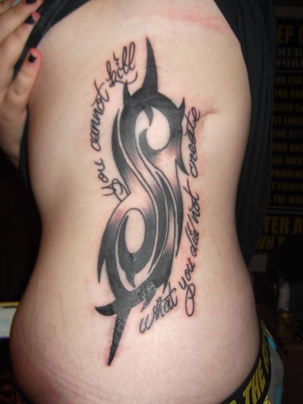 Nice Slipknot Tribal Logo With Lettering Tattoo On Side Rib