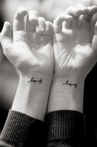 Nicely Written Love Word Matching Tattoos On Wrists