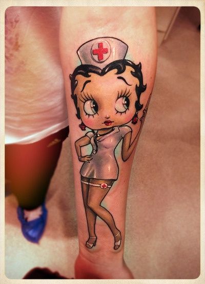 Nurse Betty Boop Tattoo On Girl Left Forearm
