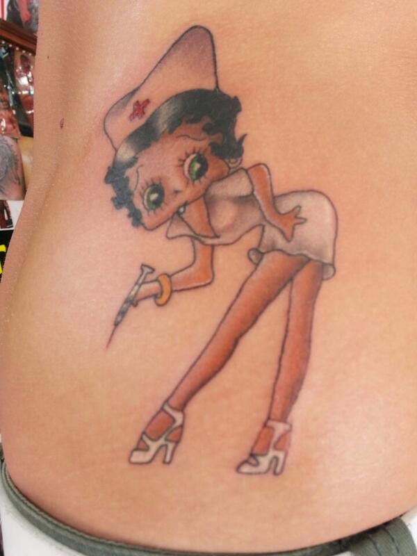 Nurse Betty Boop With Syringe Tattoo On Side Rib
