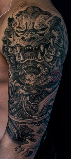 Outstanding Grey Ink Foo Dog Tattoo On Half Sleeve By Winson