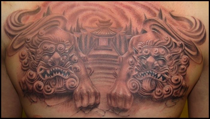 Realistic Foo Dogs With Pagoda Tattoo On Chest