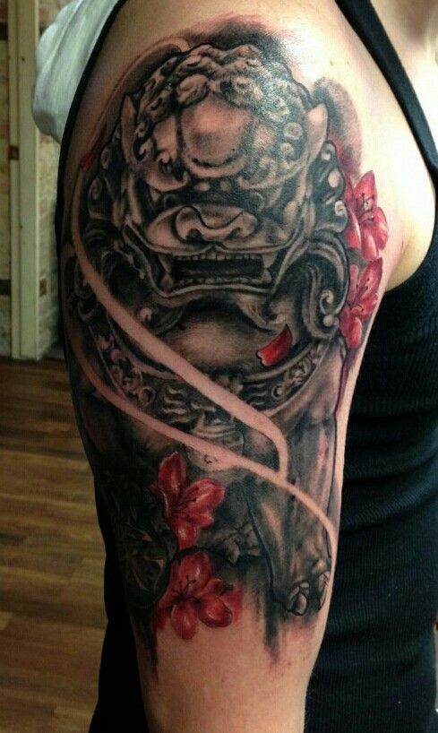 Realistic Japanese Foo Dog With Red Flowers Tattoo On Right Half Sleeve