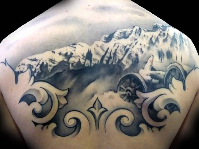 Realistic Mountains With Wheels Tattoo On Upper Back
