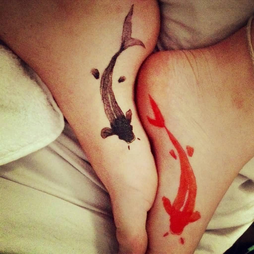 Red And Grey Color Fishes Matching Tattoos On Foots