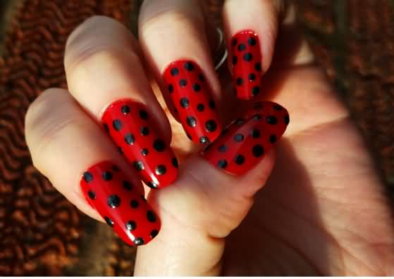 Red Base Nails With Black Polka Dots Nail Art