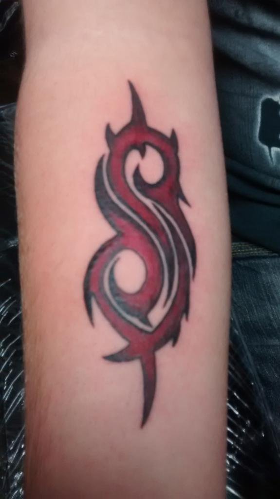 Red Color Slipknot Tribal Logo Tattoo On Forearm