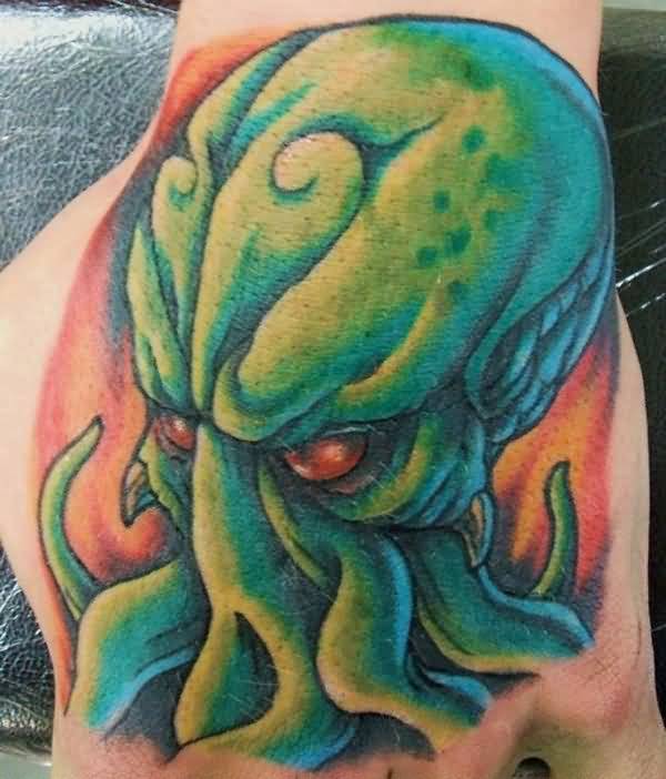 Red Eyes Green Cthulhu Tattoo On Left Hand